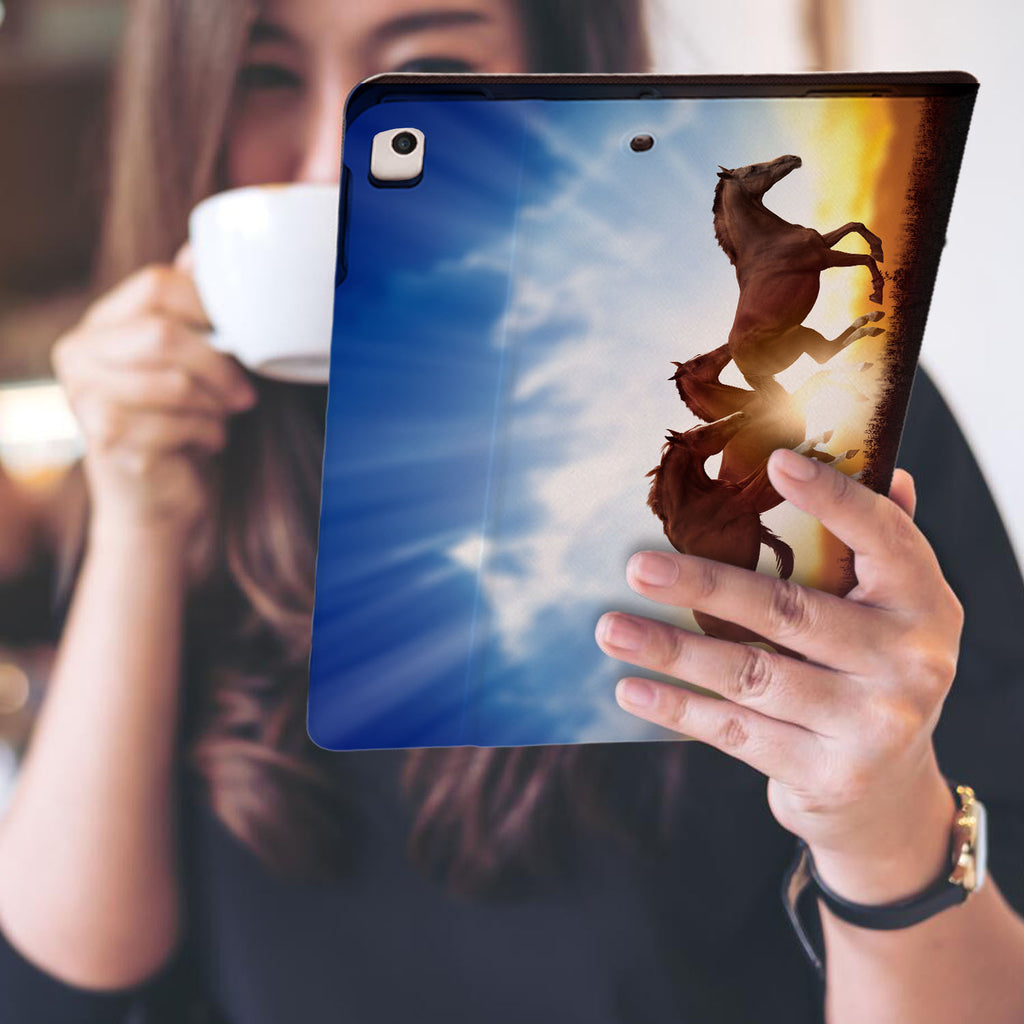 a girl is holding and viewing personalized iPad folio case with Horse design