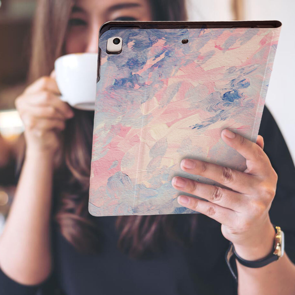 a girl is holding and viewing personalized iPad folio case with Oil Painting Abstract design
