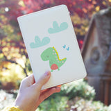 a girl holding personalized RFID blocking passport travel wallet with Dino design