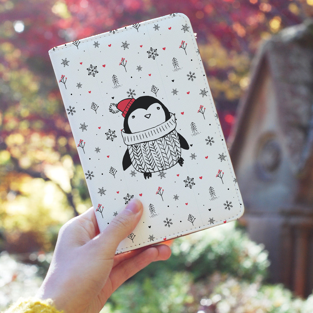 a girl holding personalized RFID blocking passport travel wallet with Penguins design