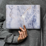 Form-fitting hardshell with Marble design keeps scuffs and scratches at bay