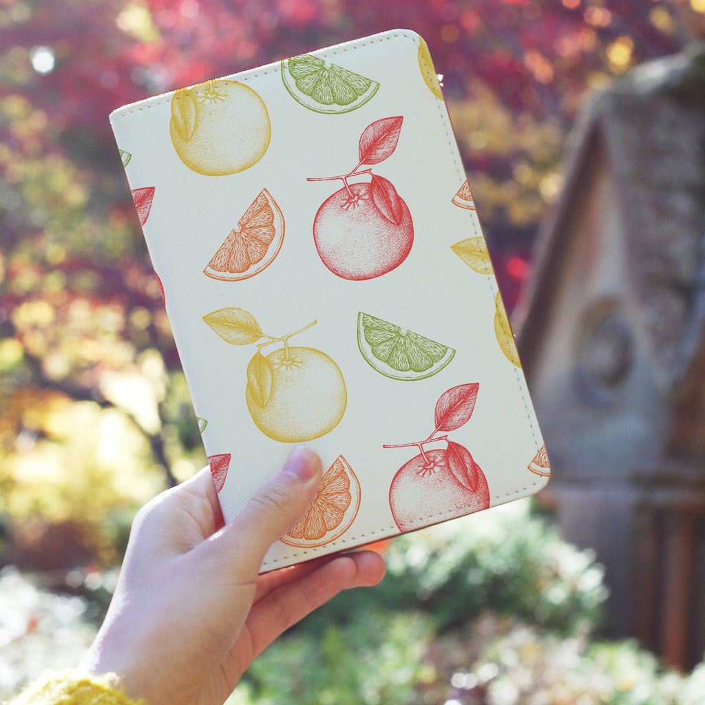 a girl holding personalized RFID blocking passport travel wallet with Fruits design