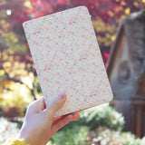 a girl holding personalized RFID blocking passport travel wallet with Marble Tiles design