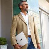 A business man carrying personalized microsoft surface case with Retro Arcade design in the park