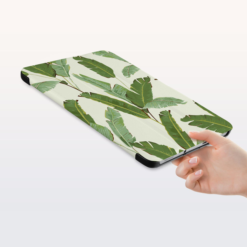 a hand is holding the Personalized Samsung Galaxy Tab Case with Green Leaves design