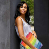 A yong girl holding personalized microsoft surface laptop case with Rainbow design
