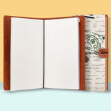 the front top view of midori style traveler's notebook with Travel design