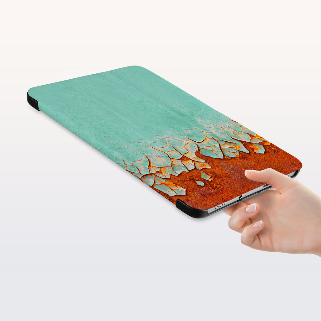 a hand is holding the Personalized Samsung Galaxy Tab Case with Rusted Metal design