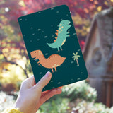 a girl holding personalized RFID blocking passport travel wallet with Dino Party design